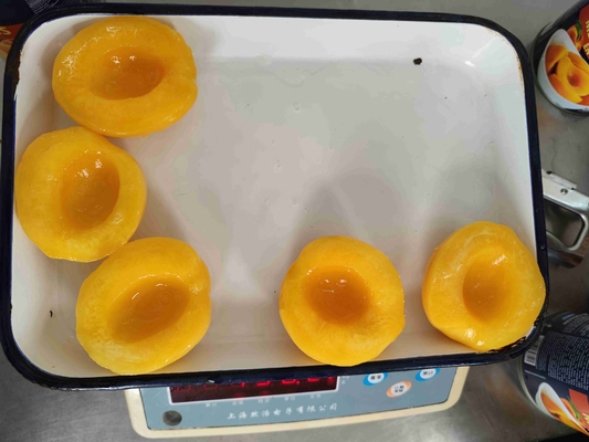 Frutta, pesche gialle in scatola etichetta privata accettabile